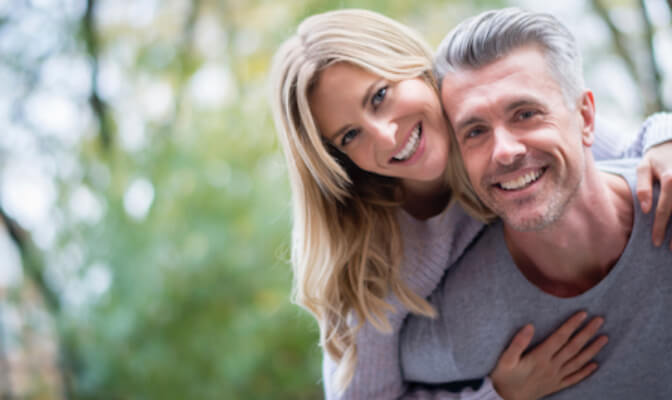 couple smiling after having their teeth cleaned at Largo Dental & Implant Center